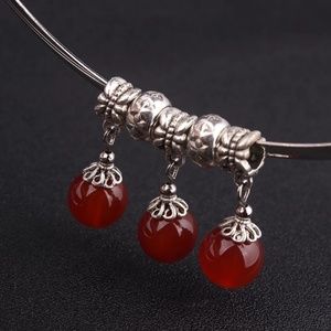 Silver neckbangle with red carnelian stones